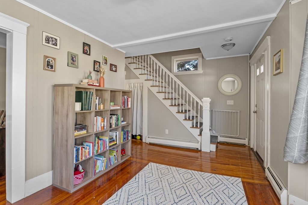 10 Stoddard Terrace Lynn, MA 01902 - Photo 20 of 40 a view of front door with lots of frames on wall and a window