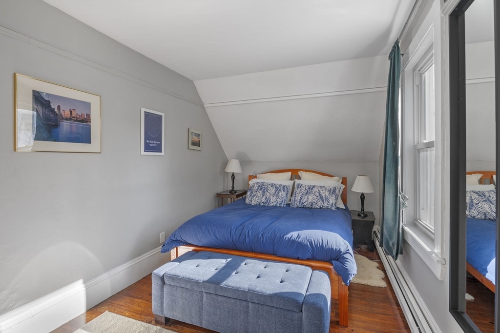 10 Stoddard Terrace Lynn, MA 01902 - Photo 25 of 40 a bedroom with a bed and wooden floor