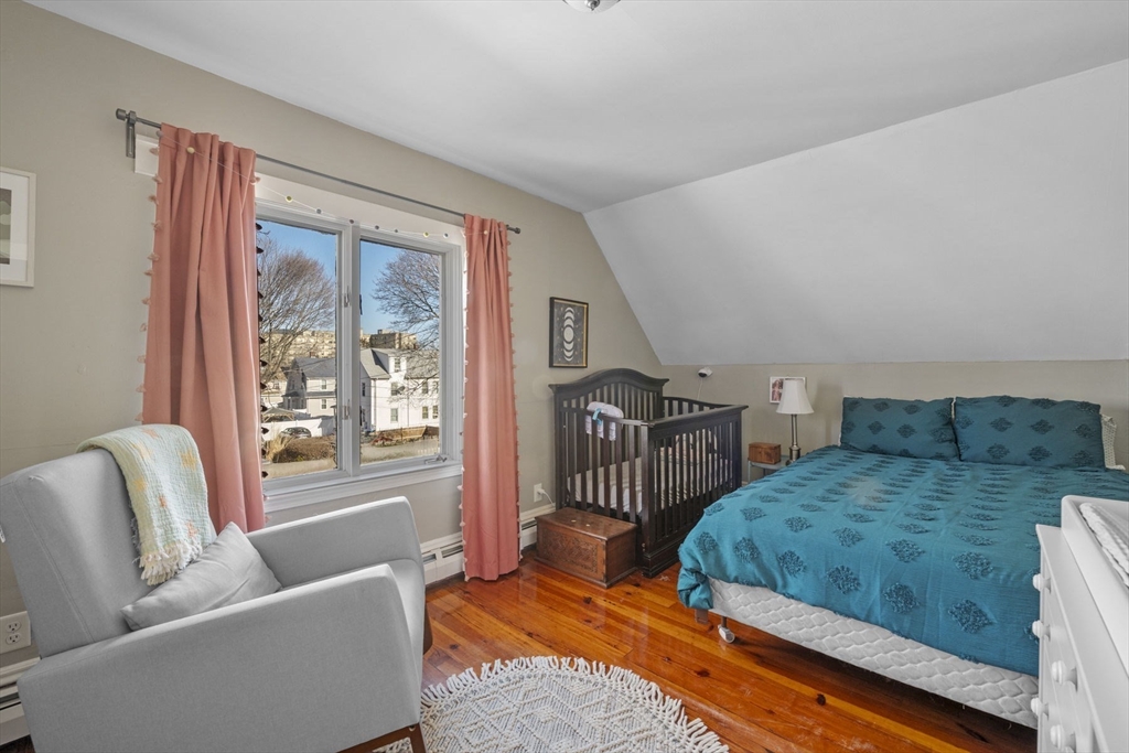 10 Stoddard Terrace Lynn, MA 01902 - Photo 27 of 40 a bedroom with furniture and a large window