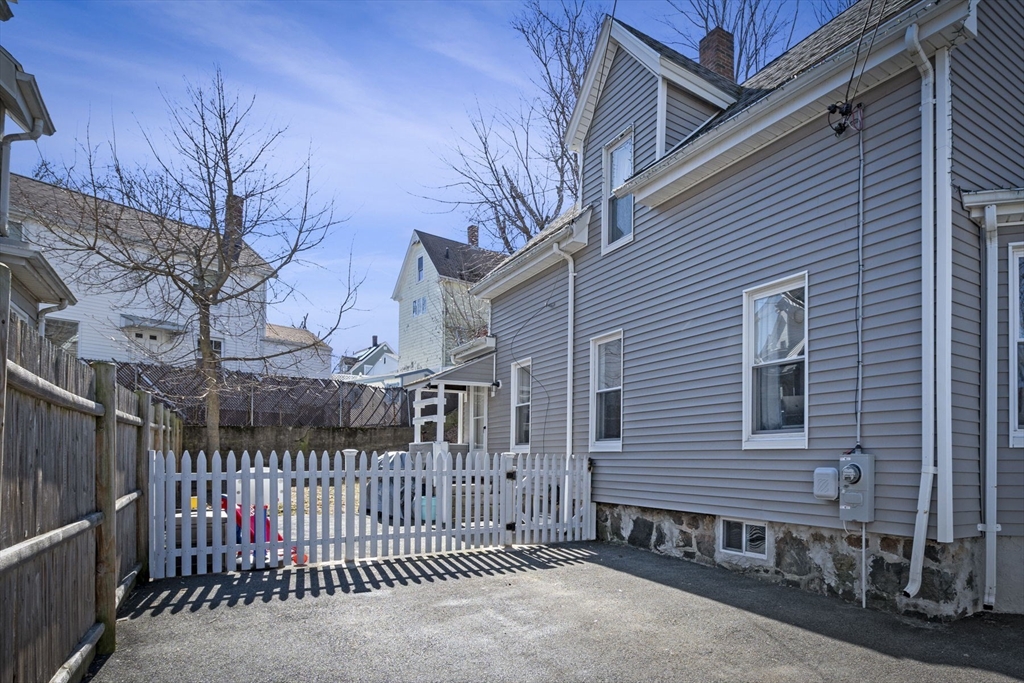 10 Stoddard Terrace Lynn, MA 01902 - Photo 29 of 40 a view of a house with a wooden fence