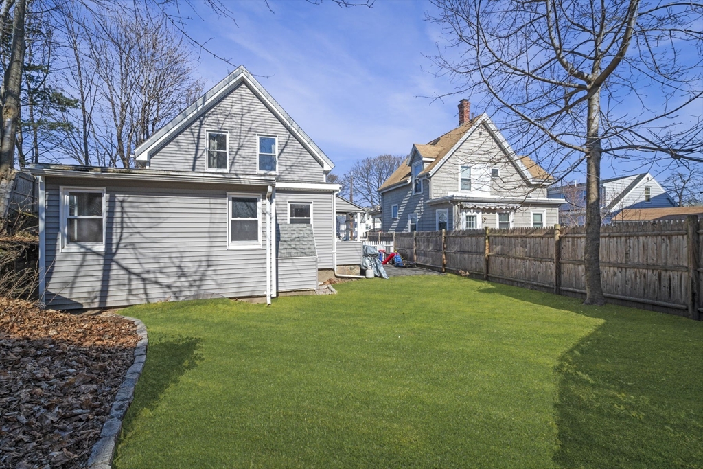 10 Stoddard Terrace Lynn, MA 01902 - Photo 30 of 40 a view of a house with a yard and a wooden deck