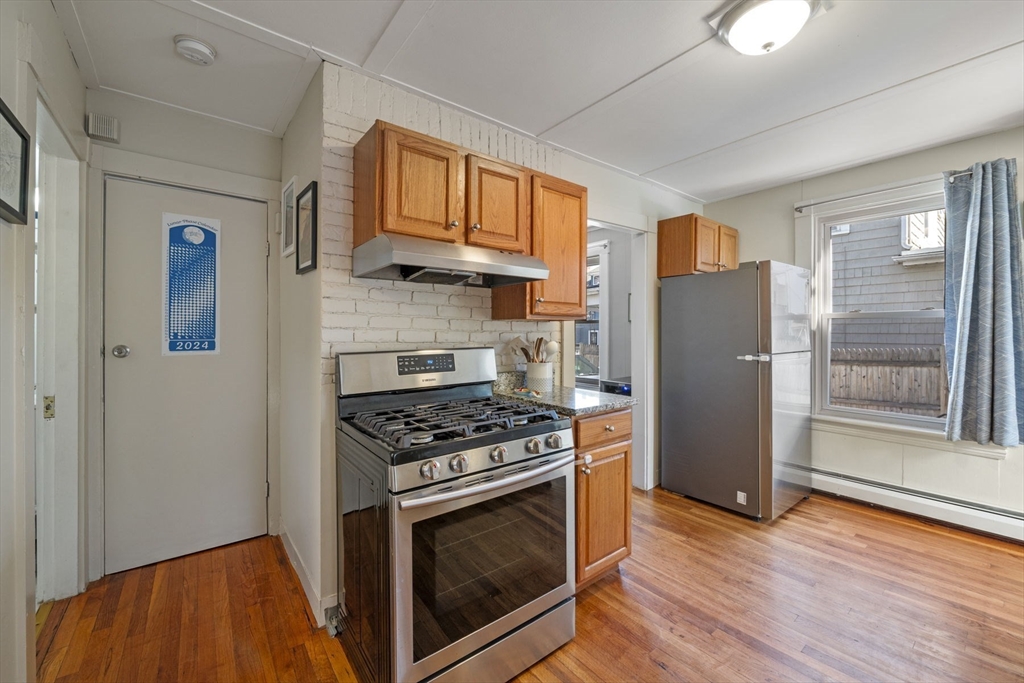 10 Stoddard Terrace Lynn, MA 01902 - Photo 7 of 40 a kitchen with stainless steel appliances a stove a refrigerator and a sink