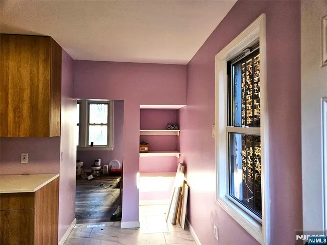 a en suite bathroom with a sink a mirror and a bathtub