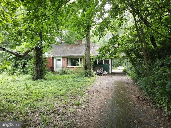 a view of a house with a tree