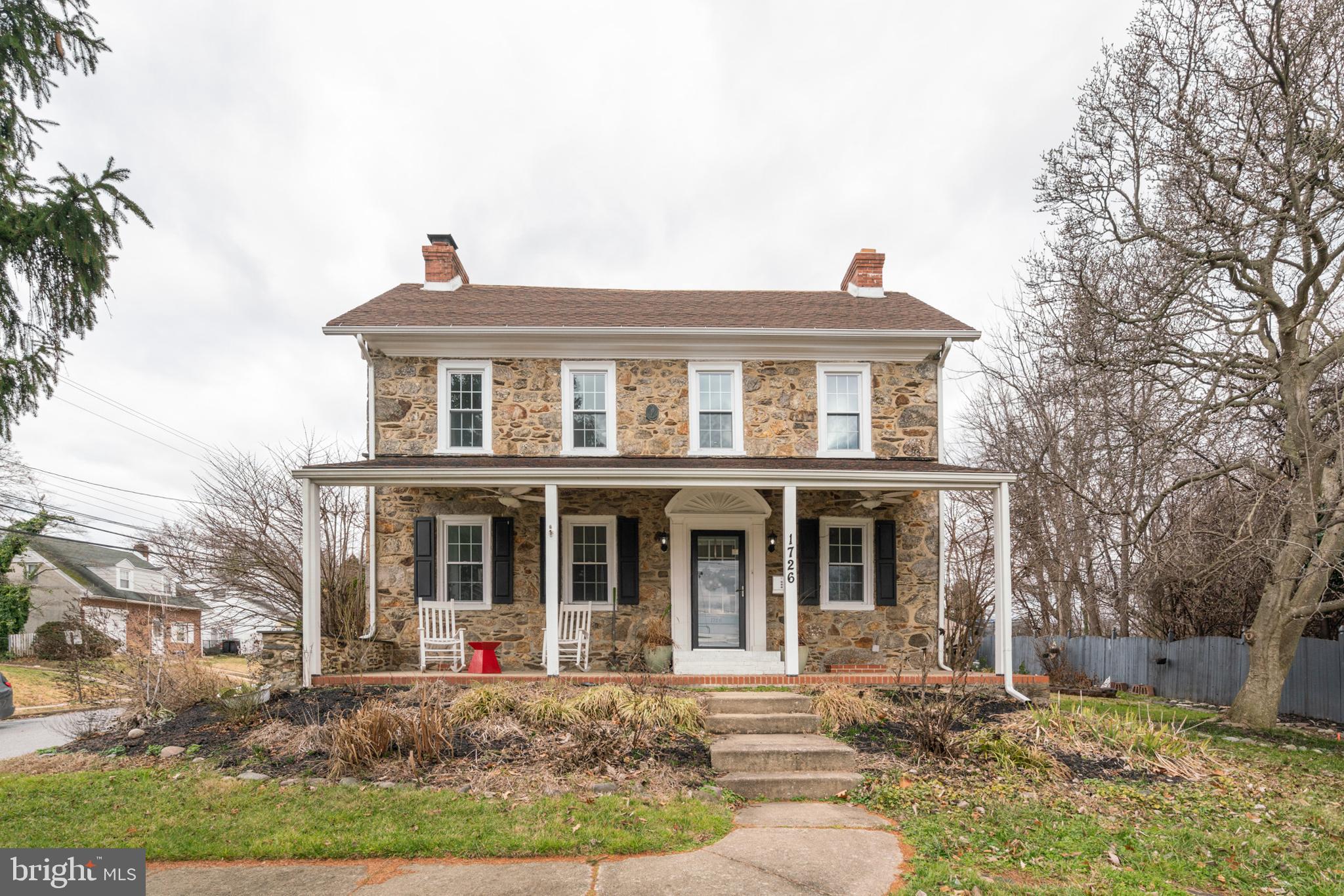 front view of a house with a yard