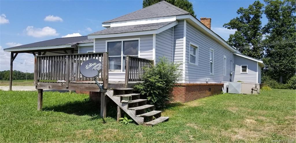 9913 Landsford Road Monroe, NC 28112 - Photo 2 of 2 a front view of a house with a garden