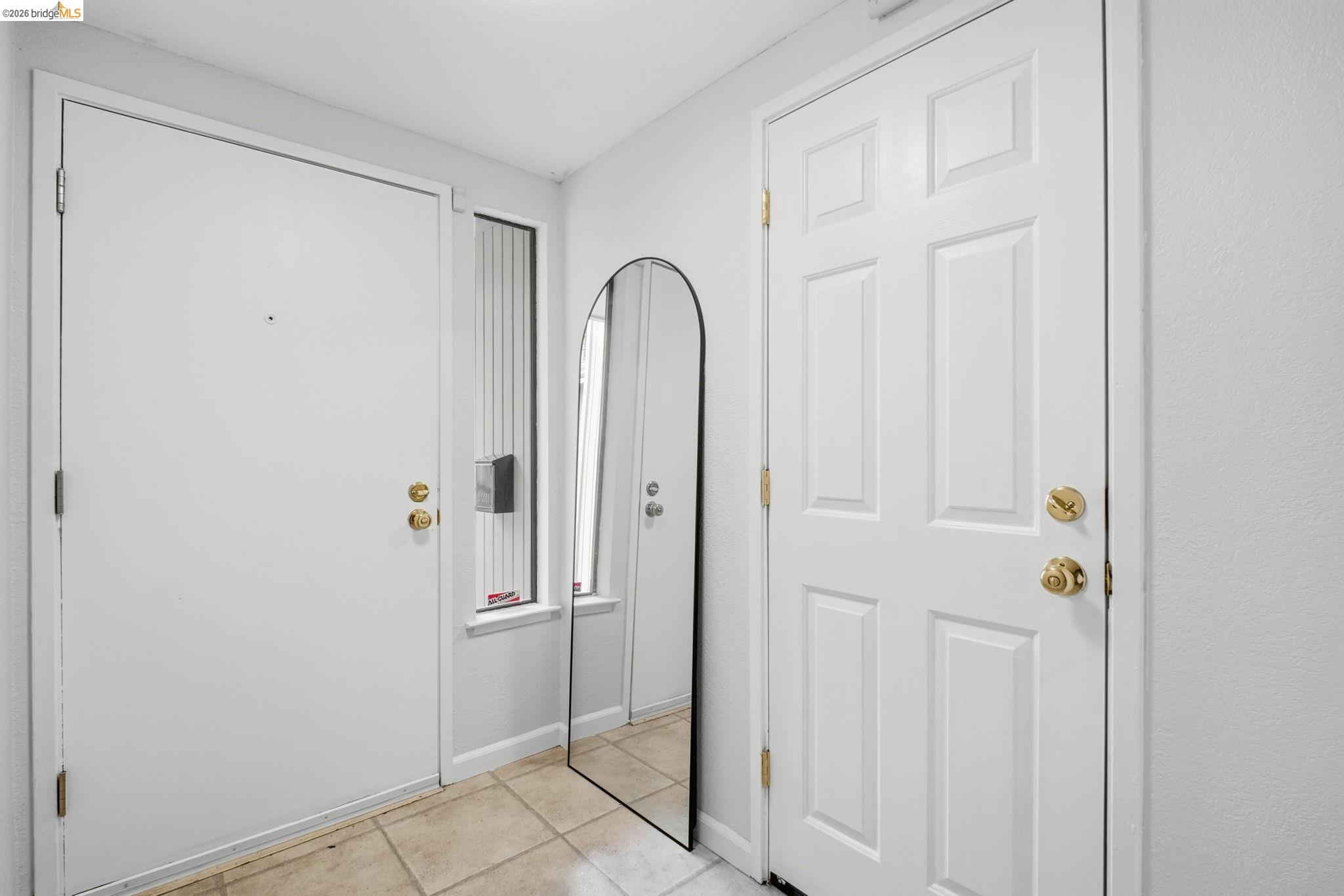 18018 Sahara Road Hayward, CA 94541 - Photo 15 of 20 Foyer entrance with light tile patterned flooring and baseboards