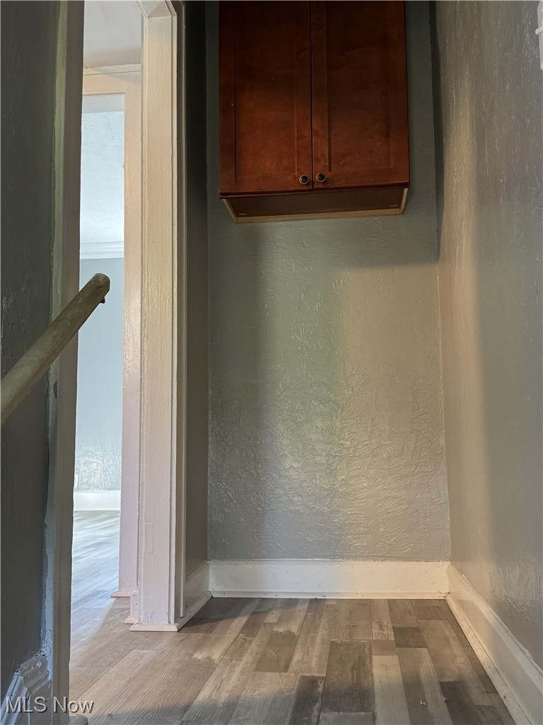 2121 Alton Road Cleveland, OH 44112 - Photo 20 of 44 Detailed view of a textured wall and wood finished floors