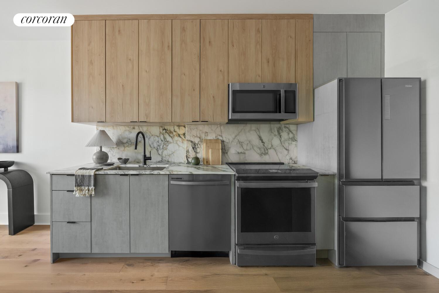 726 Madison Street, Unit 4A Brooklyn, NY 11221 - Photo 2 of 9 a kitchen with stainless steel appliances granite countertop a refrigerator stove and microwave