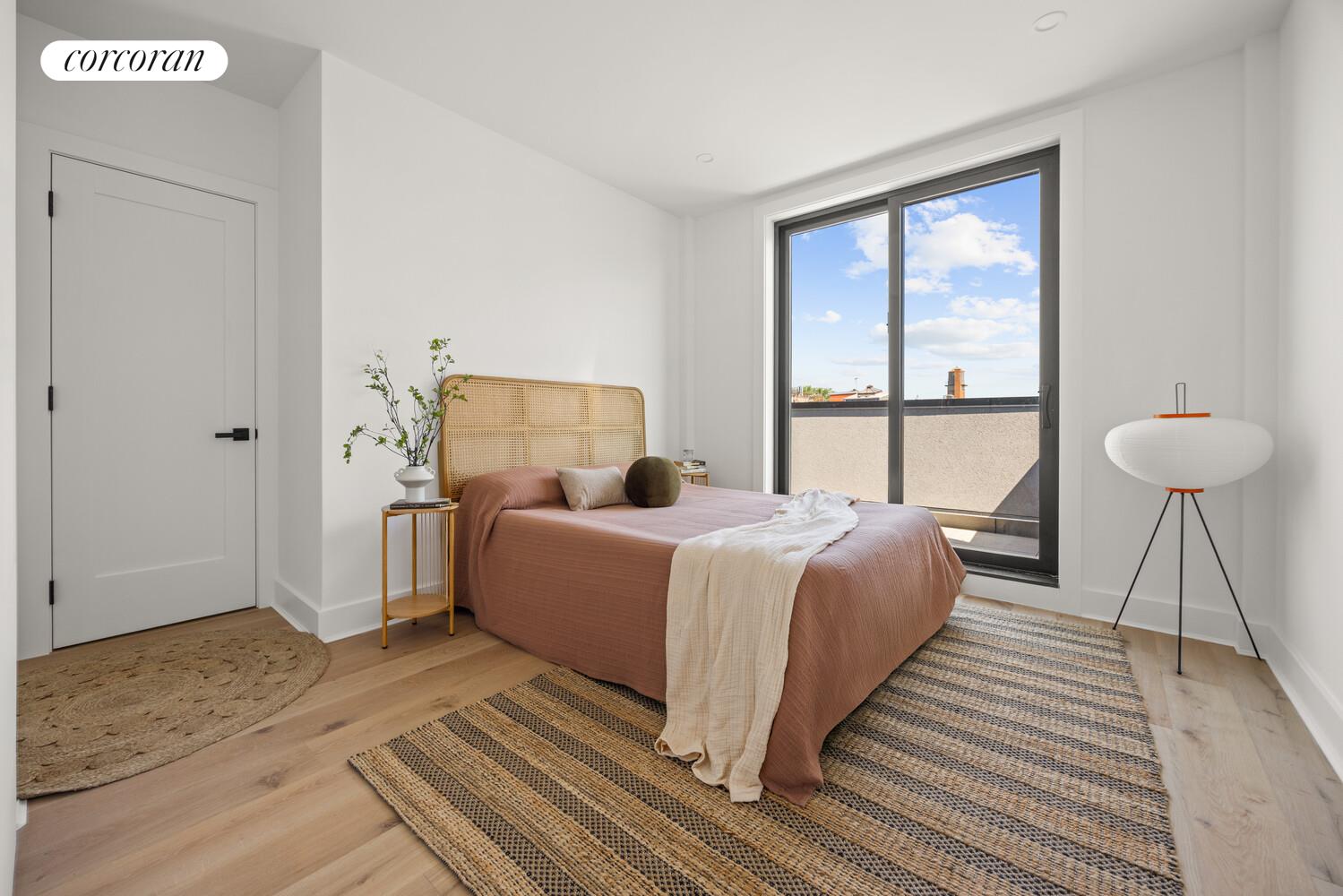 726 Madison Street, Unit 4A Brooklyn, NY 11221 - Photo 4 of 9 a bedroom with a bed and a window