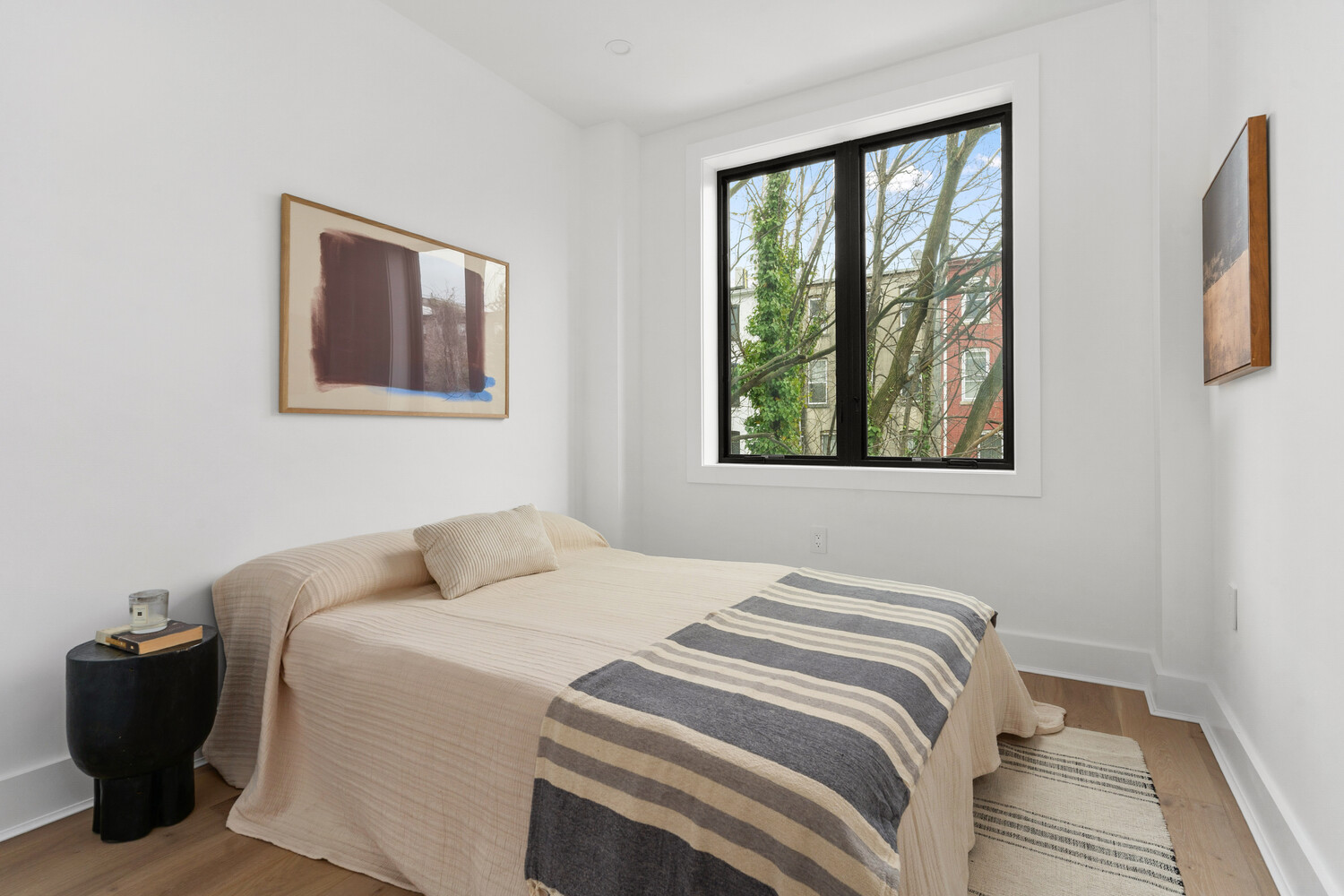 726 Madison Street, Unit 4A Brooklyn, NY 11221 - Photo 8 of 9 a bedroom with a bed and a window