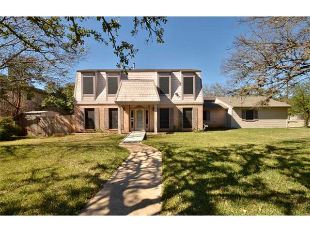 210 Blue Ridge Trail Austin, TX 78746 - Photo 1 of 1 a front view of a house with a yard