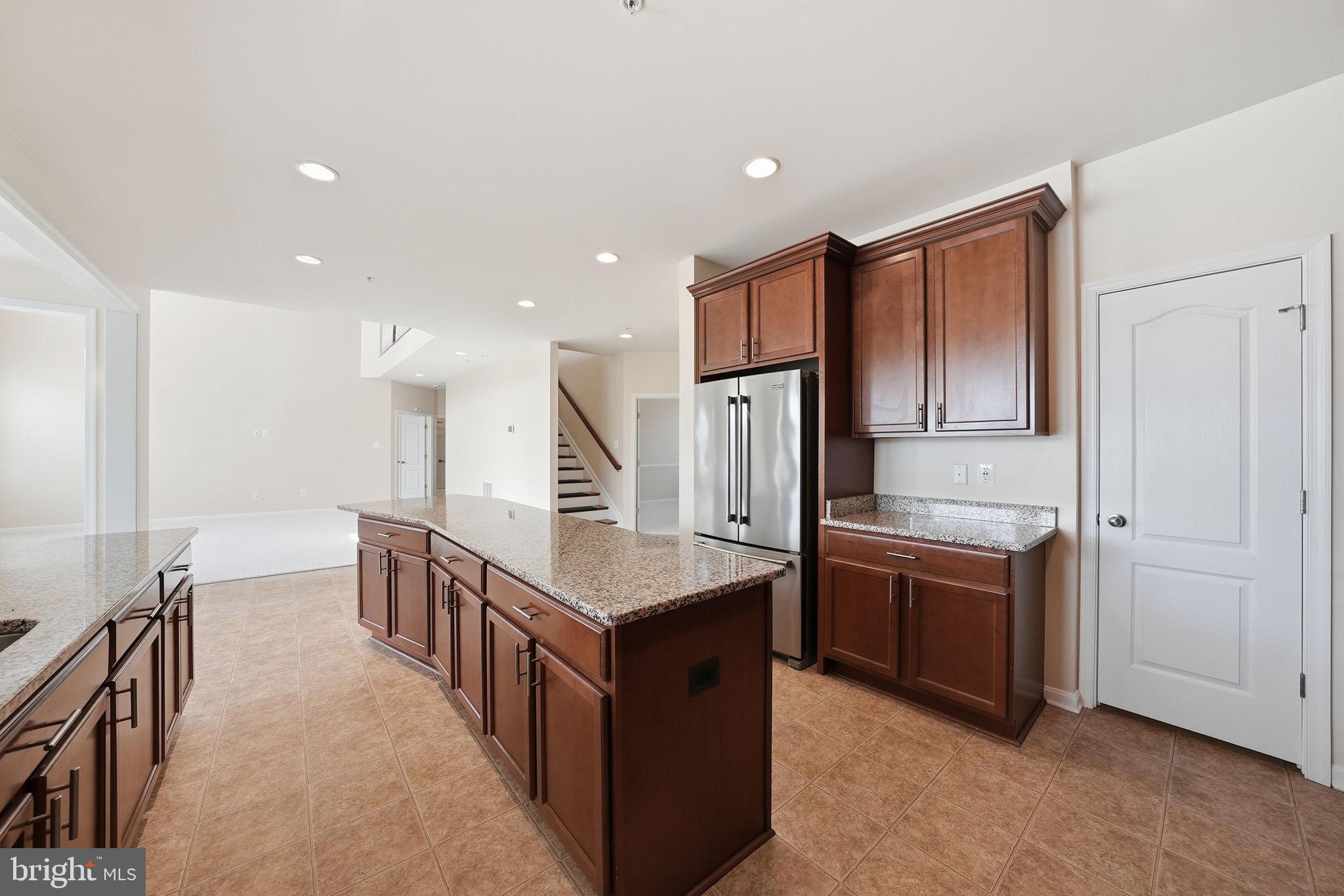 11538 Neon Road Fort Washington, MD 20744 - Photo 11 of 58 a kitchen with stainless steel appliances granite countertop a refrigerator and a stove