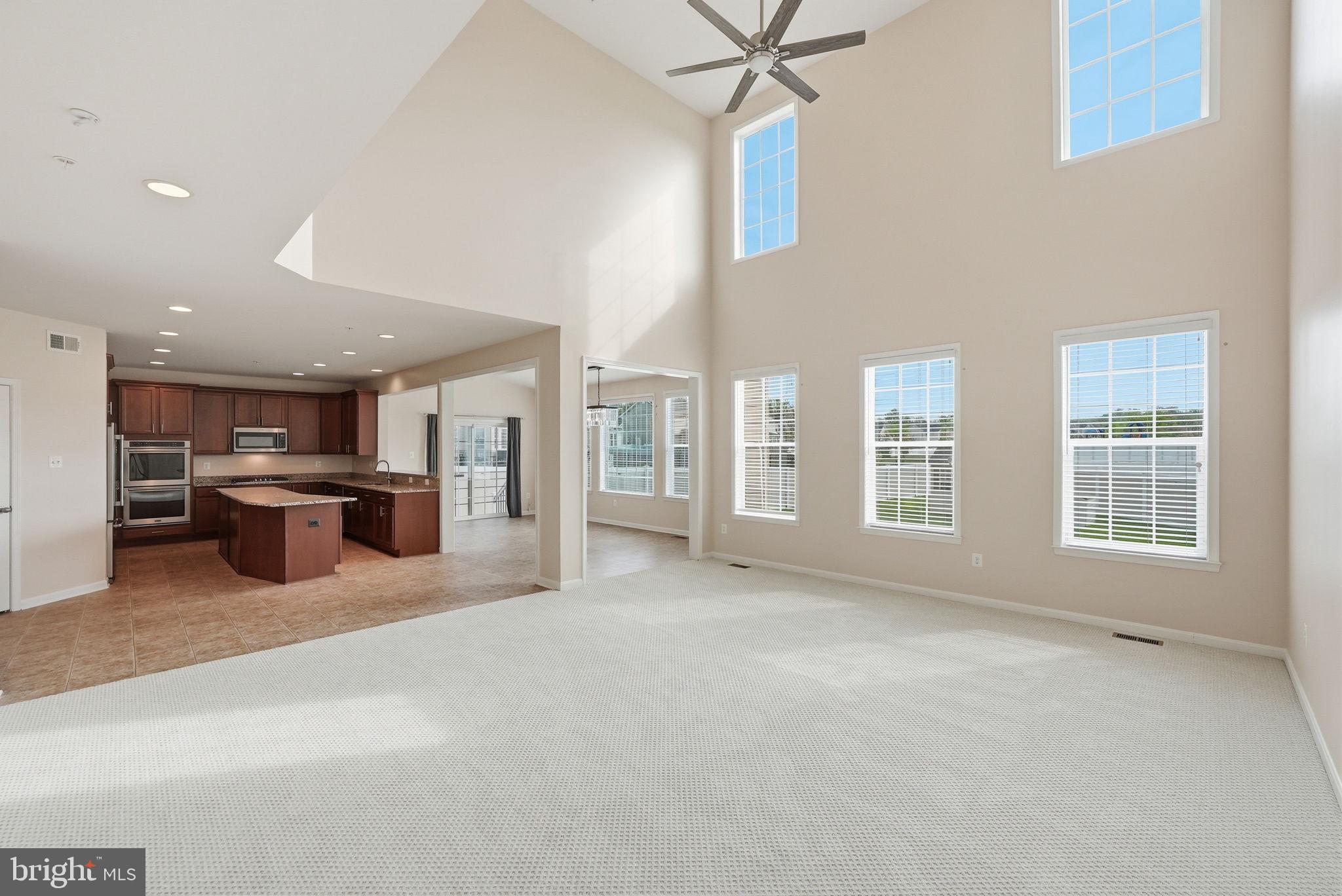 11538 Neon Road Fort Washington, MD 20744 - Photo 15 of 58 a view of an empty room with a kitchen