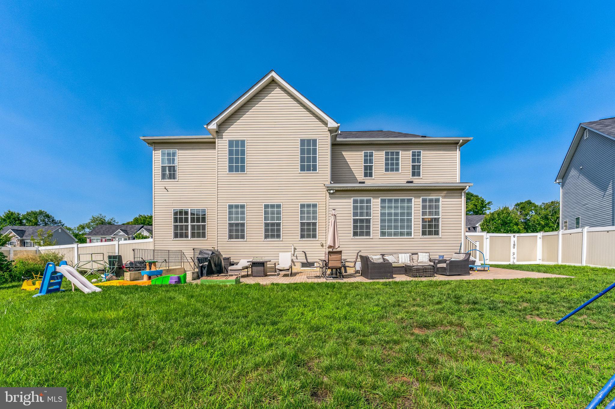 11538 Neon Road Fort Washington, MD 20744 - Photo 22 of 50 a front view of a house with a yard table and chairs