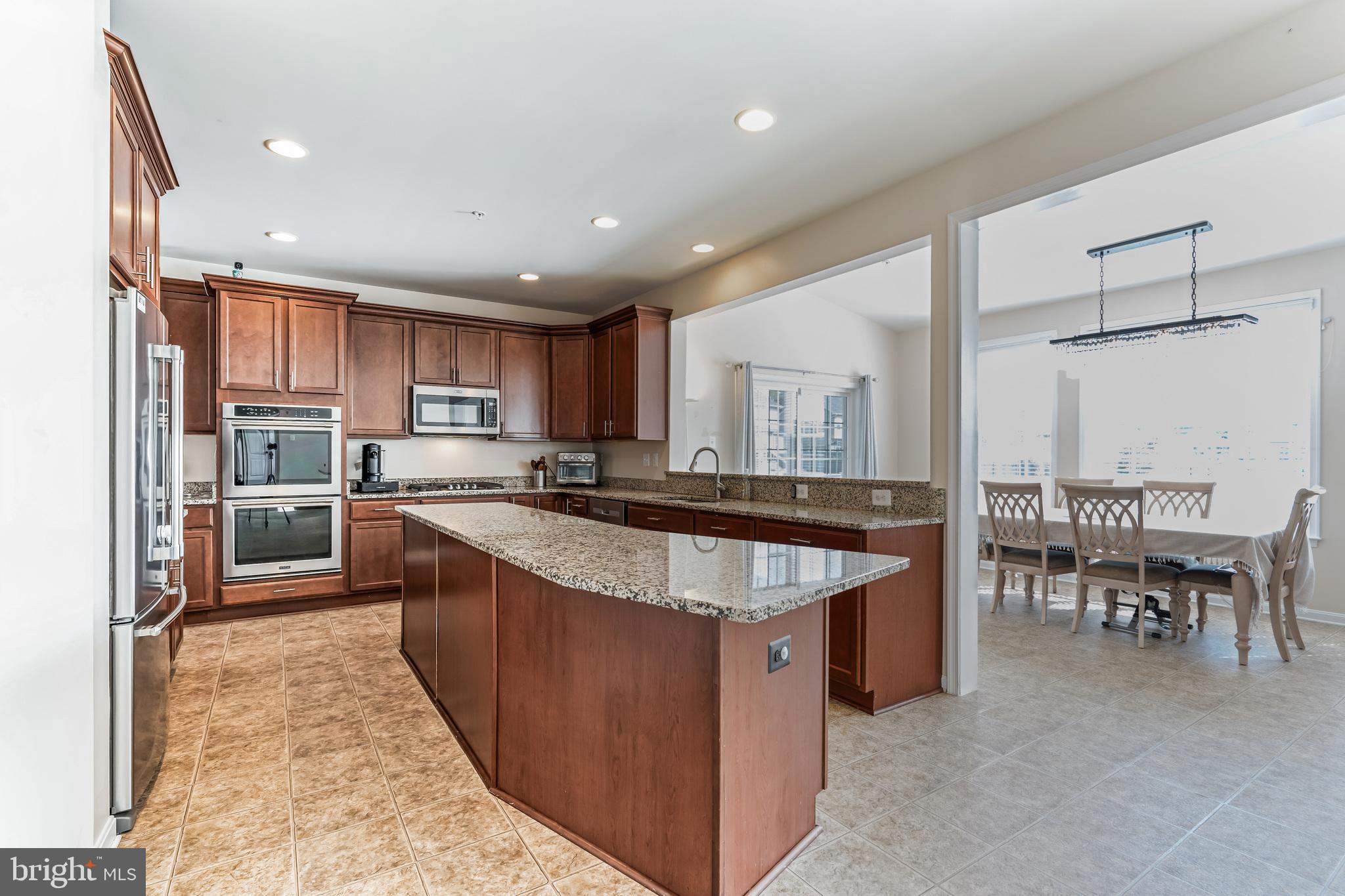 11538 Neon Road Fort Washington, MD 20744 - Photo 25 of 50 a large kitchen with stainless steel appliances lots of counter top space