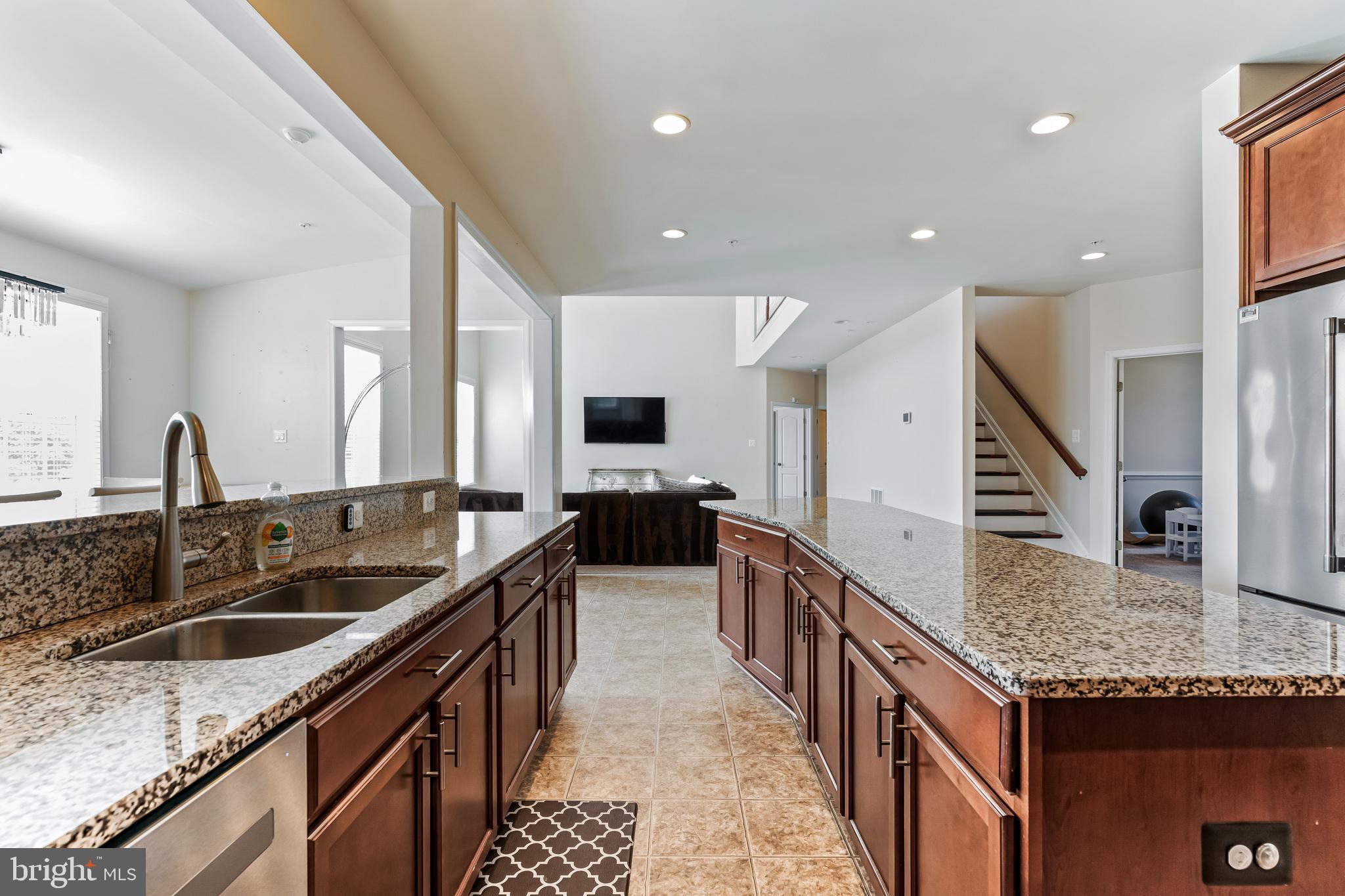 11538 Neon Road Fort Washington, MD 20744 - Photo 29 of 50 a kitchen with granite countertop a sink and a stove
