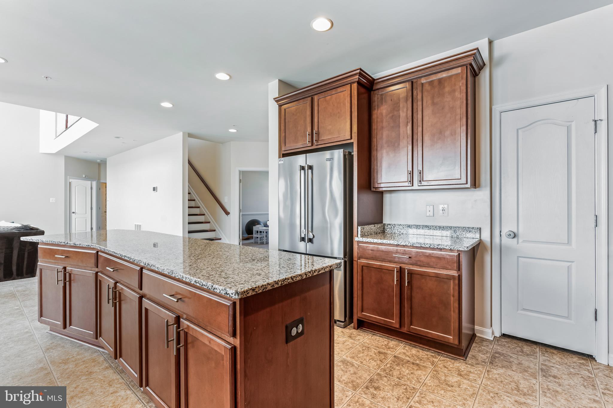 11538 Neon Road Fort Washington, MD 20744 - Photo 30 of 50 a kitchen with stainless steel appliances granite countertop a refrigerator and a stove
