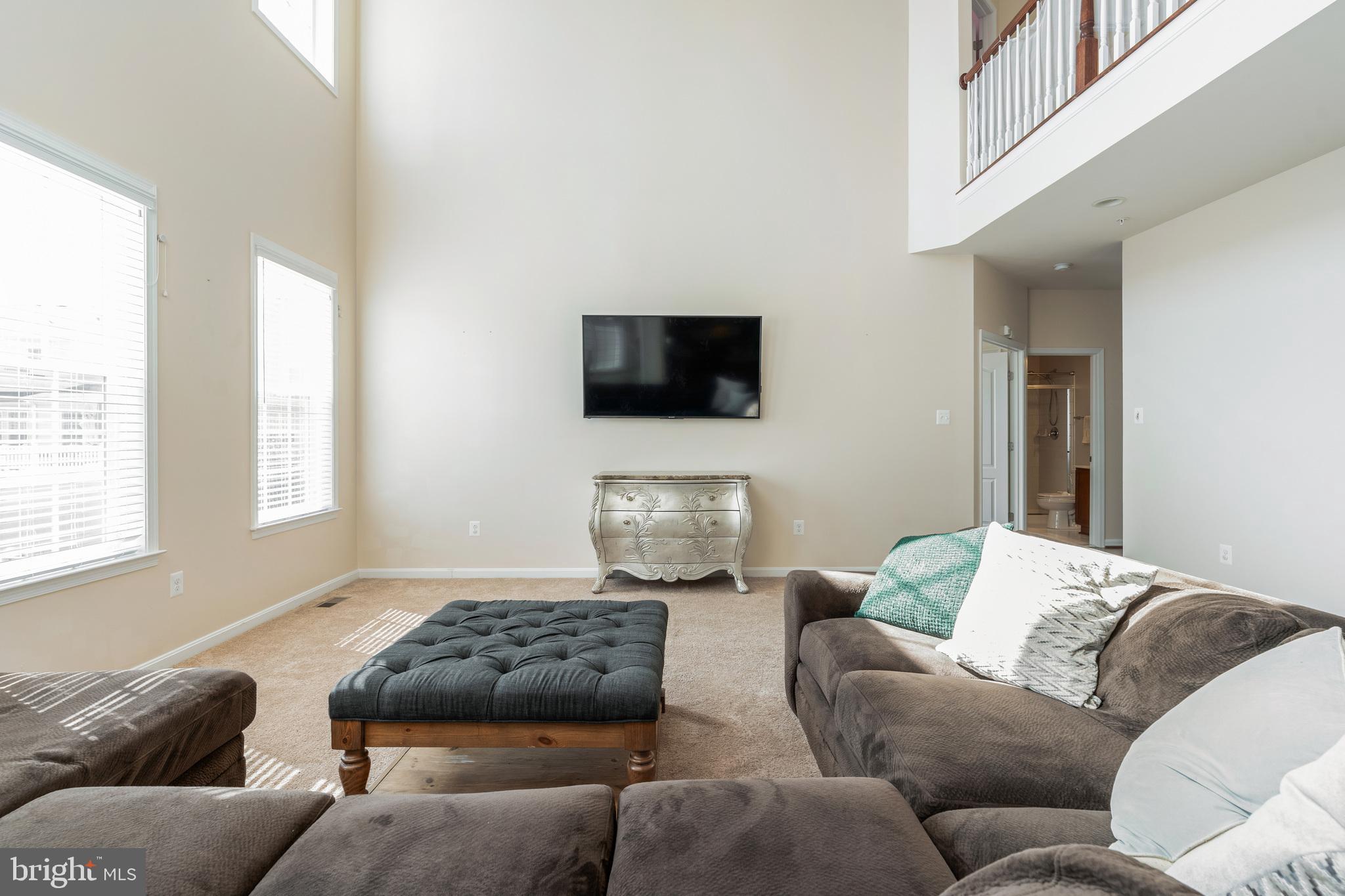 11538 Neon Road Fort Washington, MD 20744 - Photo 39 of 50 a living room with furniture a couch and a flat screen tv