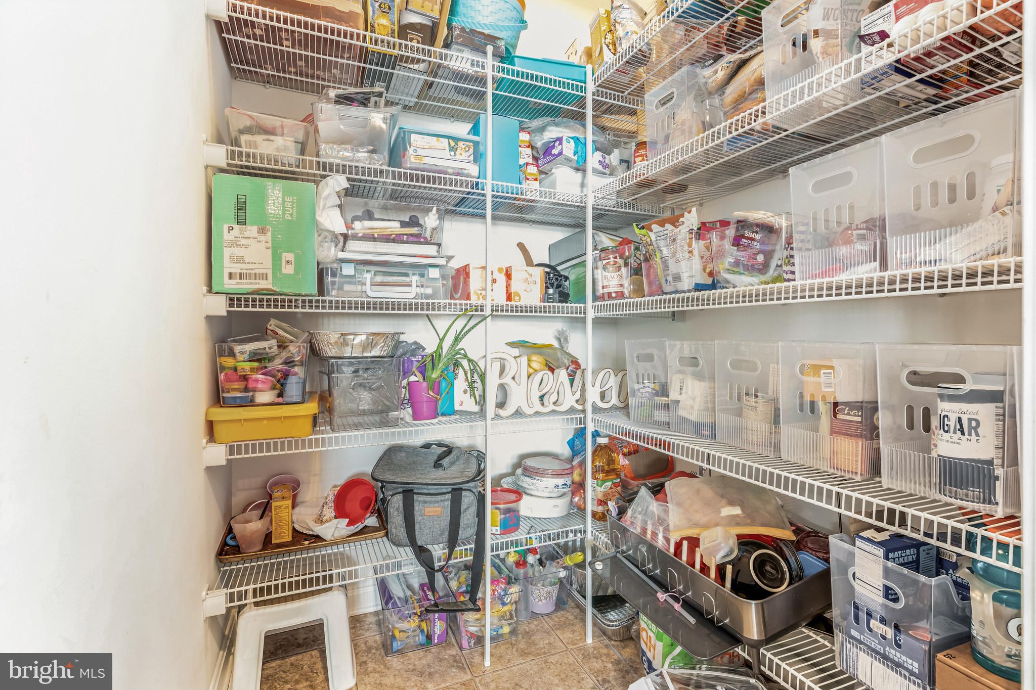 11538 Neon Road Fort Washington, MD 20744 - Photo 48 of 50 a store room with stainless steel appliances and a table