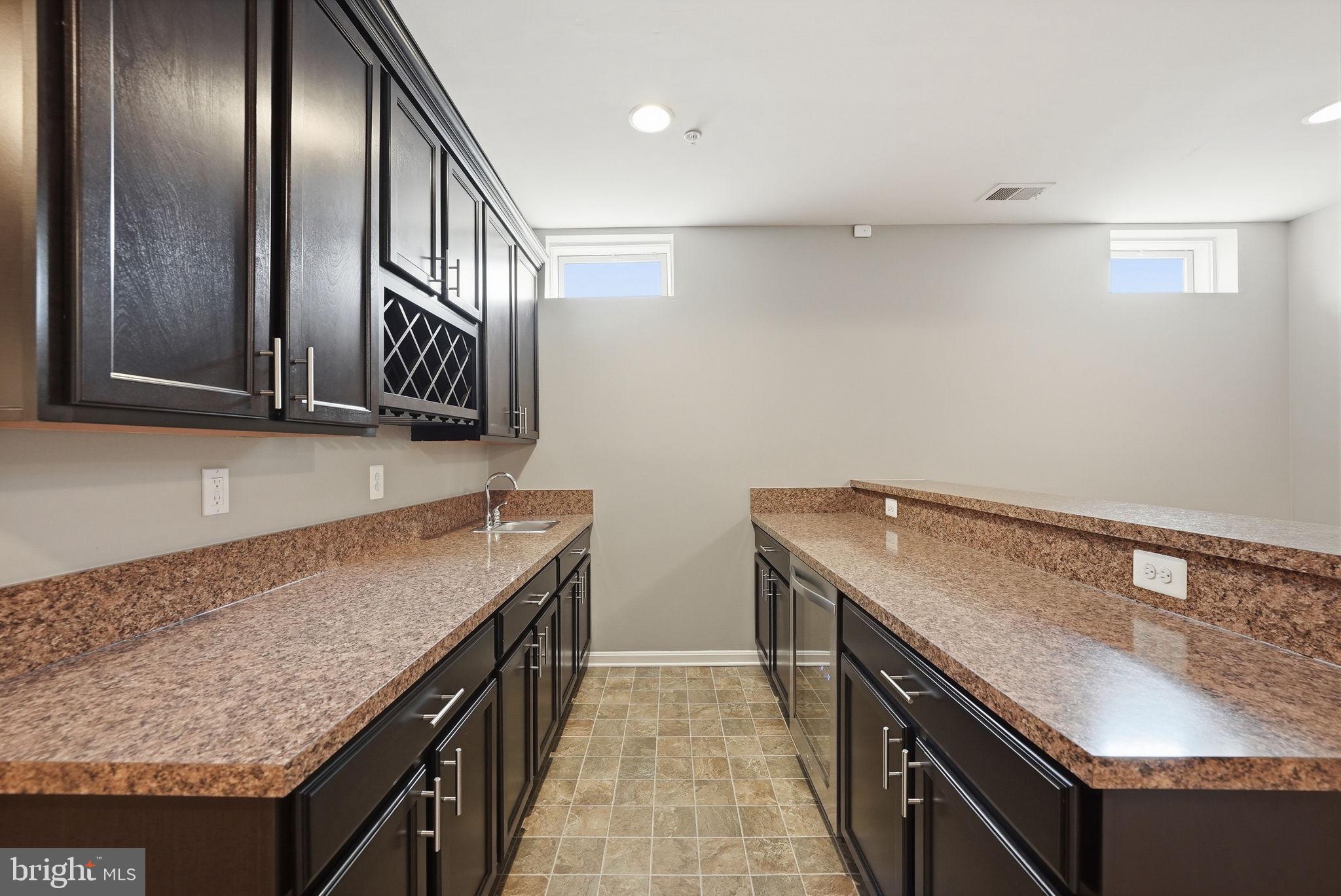 11538 Neon Road Fort Washington, MD 20744 - Photo 49 of 58 a kitchen with granite countertop stainless steel appliances a sink and stove