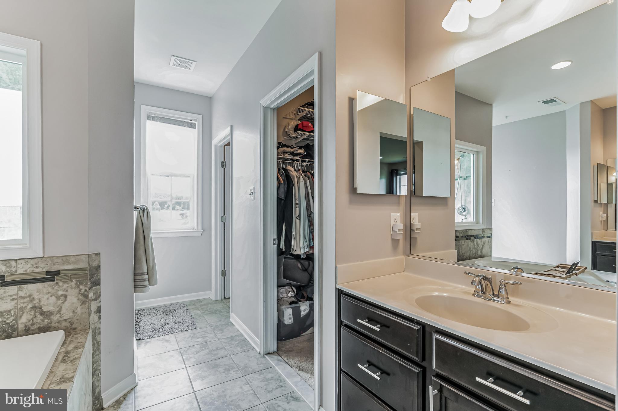 11538 Neon Road Fort Washington, MD 20744 - Photo 5 of 50 a bathroom with a sink and a mirror