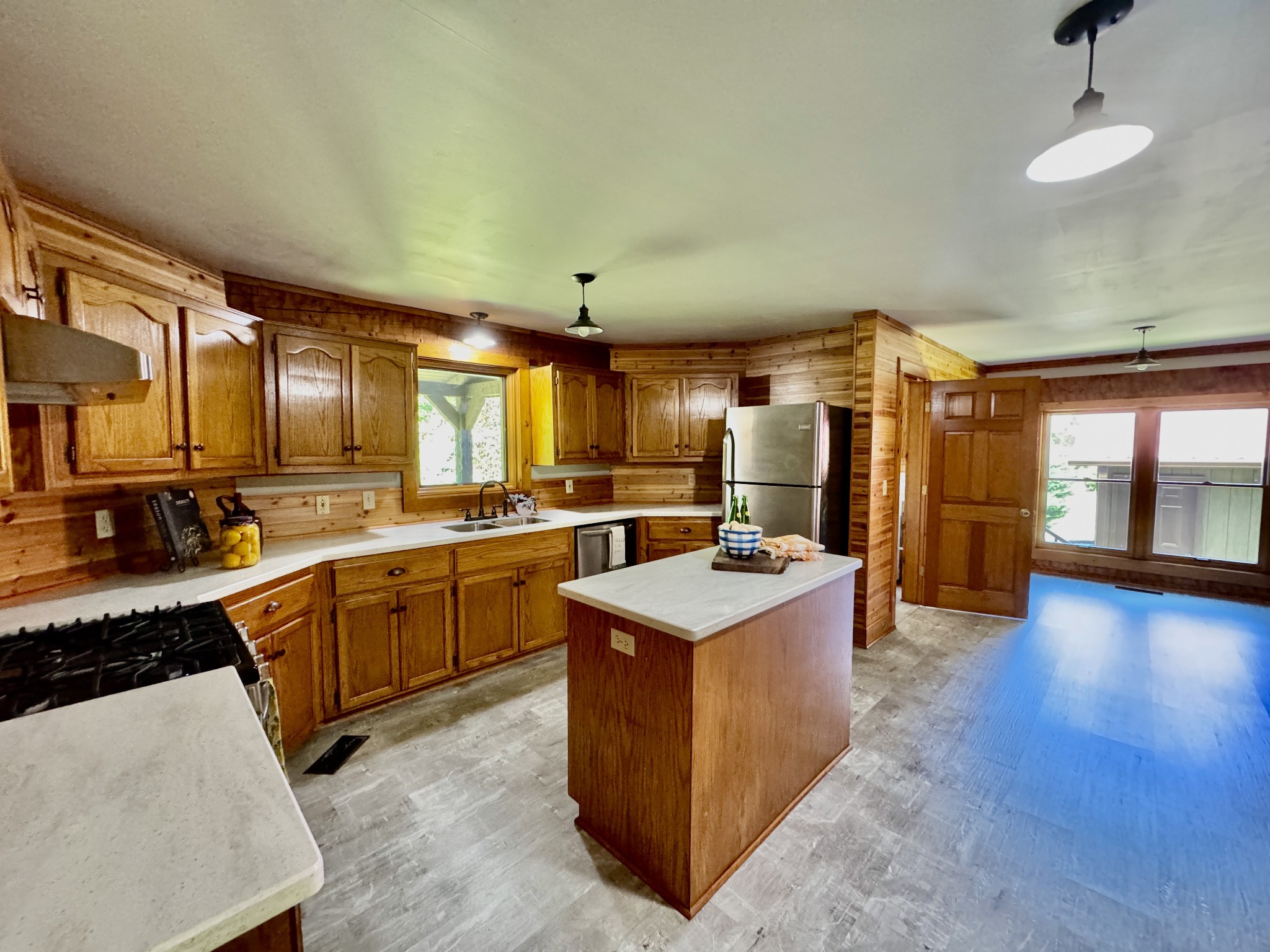 1342 Aetna Church Road Centerville, TN 37033 - Photo 15 of 59 a kitchen with stainless steel appliances granite countertop a sink stove and refrigerator