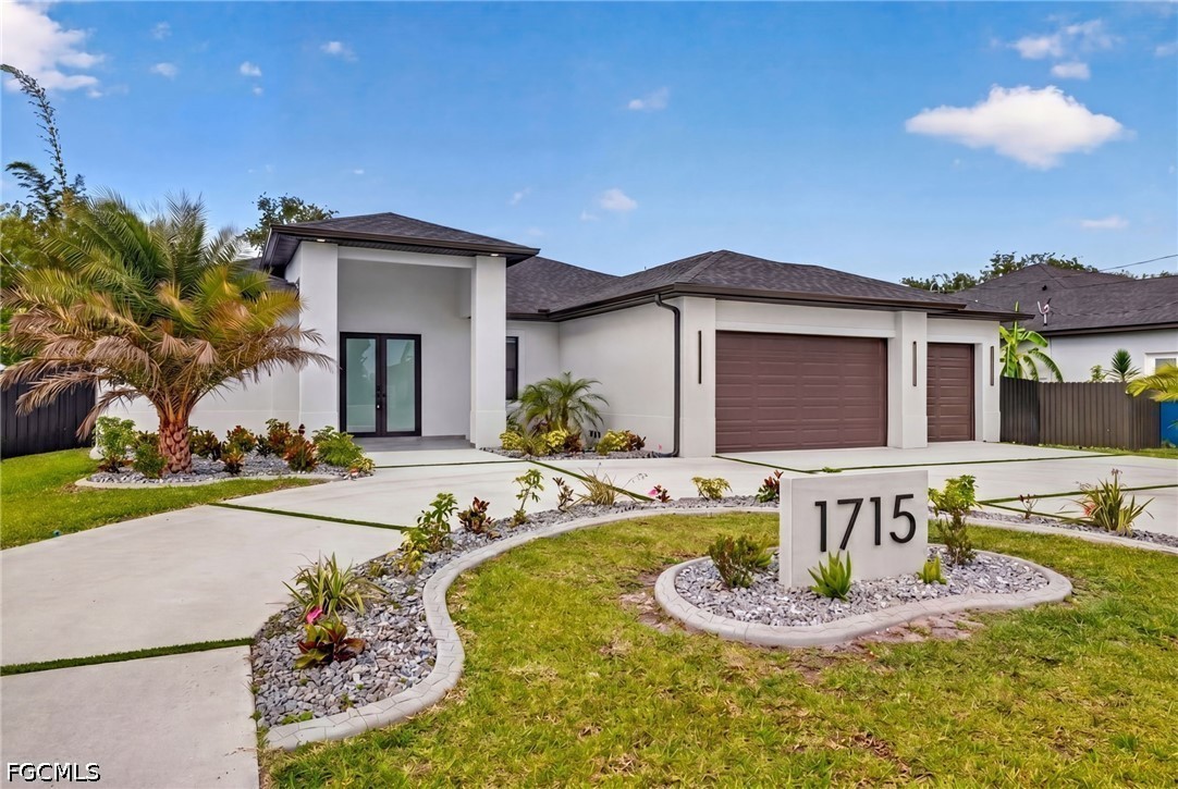 1715 Southwest 4th Street Cape Coral, FL 33991 - Photo 1 of 42 a front view of a house with entertaining space