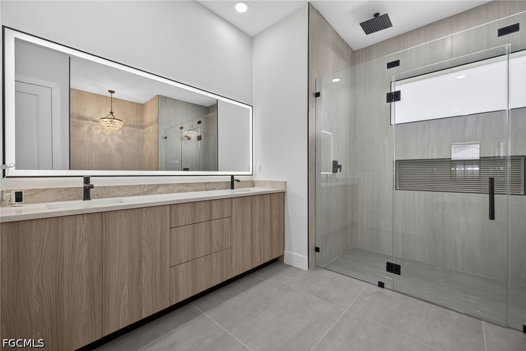1715 Southwest 4th Street Cape Coral, FL 33991 - Photo 20 of 42 a bathroom with a double vanity sink mirror and double