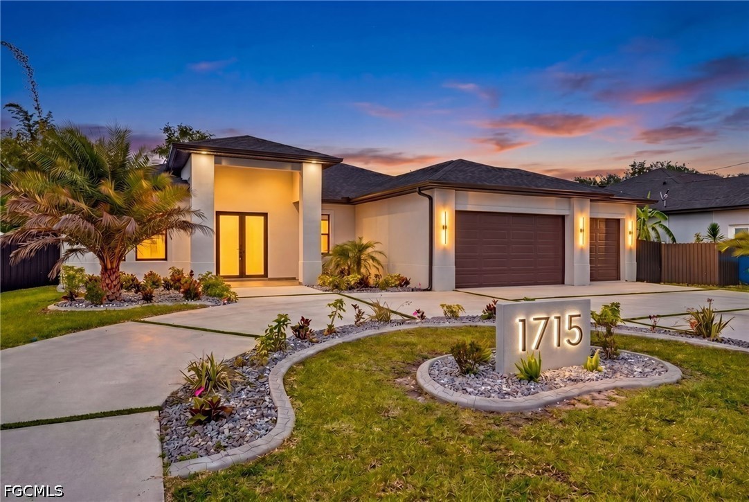 1715 Southwest 4th Street Cape Coral, FL 33991 - Photo 2 of 42 a front view of a house with entertaining space
