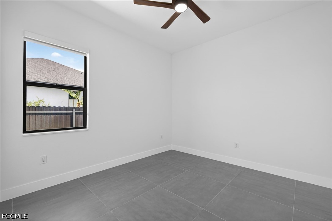 1715 Southwest 4th Street Cape Coral, FL 33991 - Photo 27 of 42 an empty room with a window