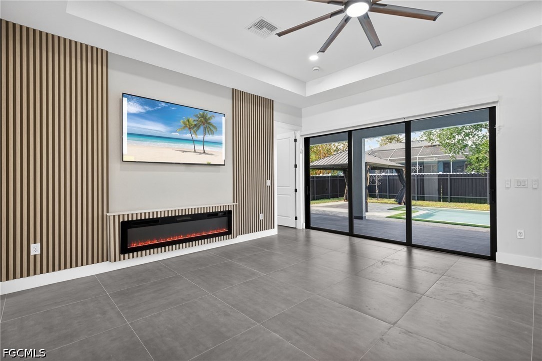 1715 Southwest 4th Street Cape Coral, FL 33991 - Photo 3 of 42 a view of an empty room with glass door