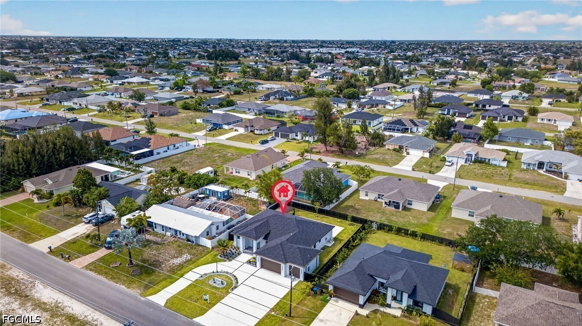 1715 Southwest 4th Street Cape Coral, FL 33991 - Photo 40 of 42 an aerial view of a house with a swimming pool