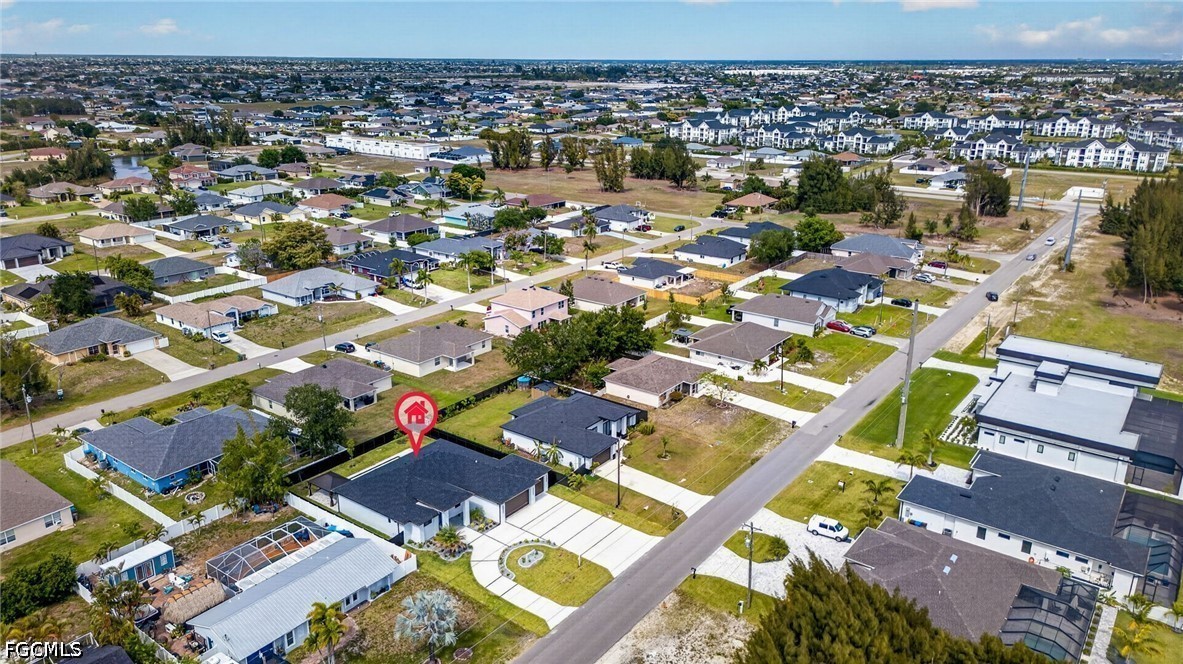 1715 Southwest 4th Street Cape Coral, FL 33991 - Photo 41 of 42 an aerial view of residential houses with outdoor space