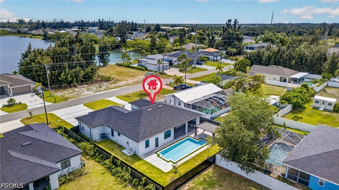 1715 Southwest 4th Street Cape Coral, FL 33991 - Photo 42 of 42 an aerial view of a house with swimming pool and outdoor seating