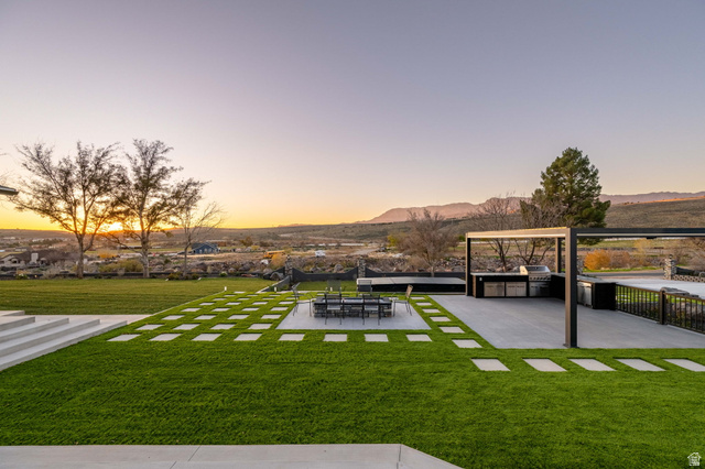 476 Spring Drive Toquerville, UT 84774 - Photo 80 of 95 View of grassy yard featuring a patio and a mountain view