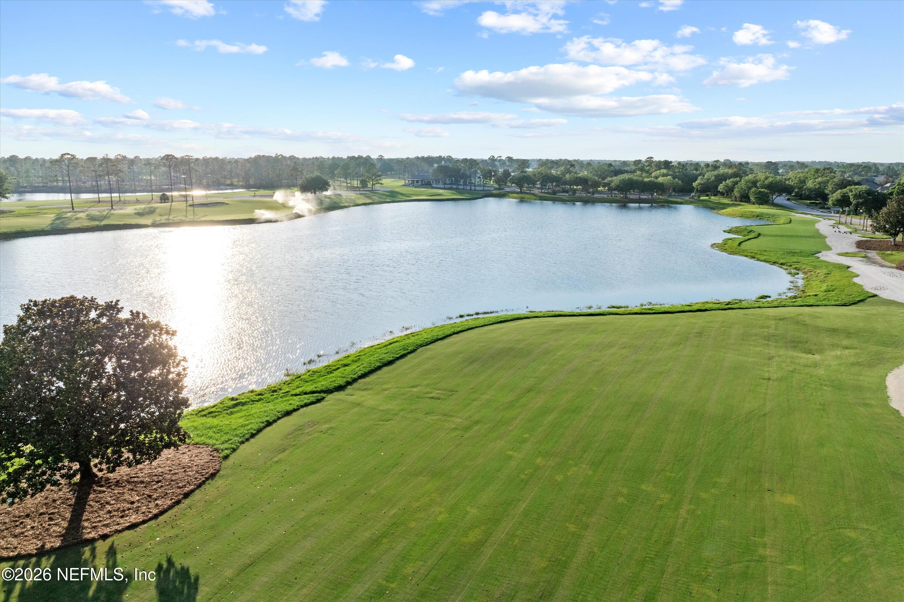 4716 Swilcan Bridge Lane Jacksonville, FL 32224 - Photo 2 of 6 a view of a lake with a city