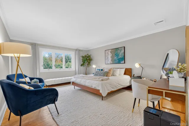 a bedroom with furniture and a window