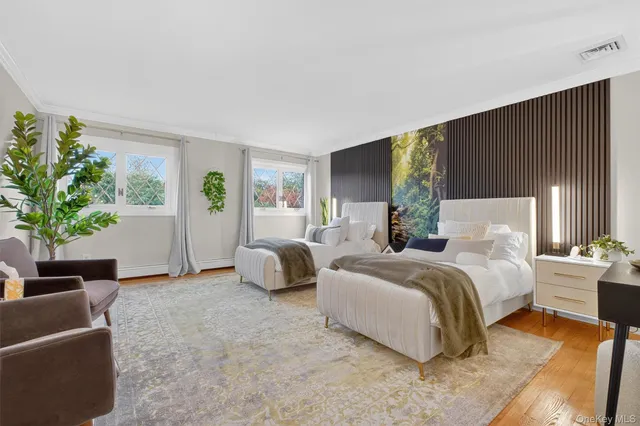 a spacious bedroom with a bed and a couch