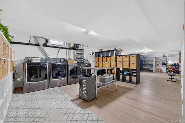 a living room with furniture a couch and a flat screen tv