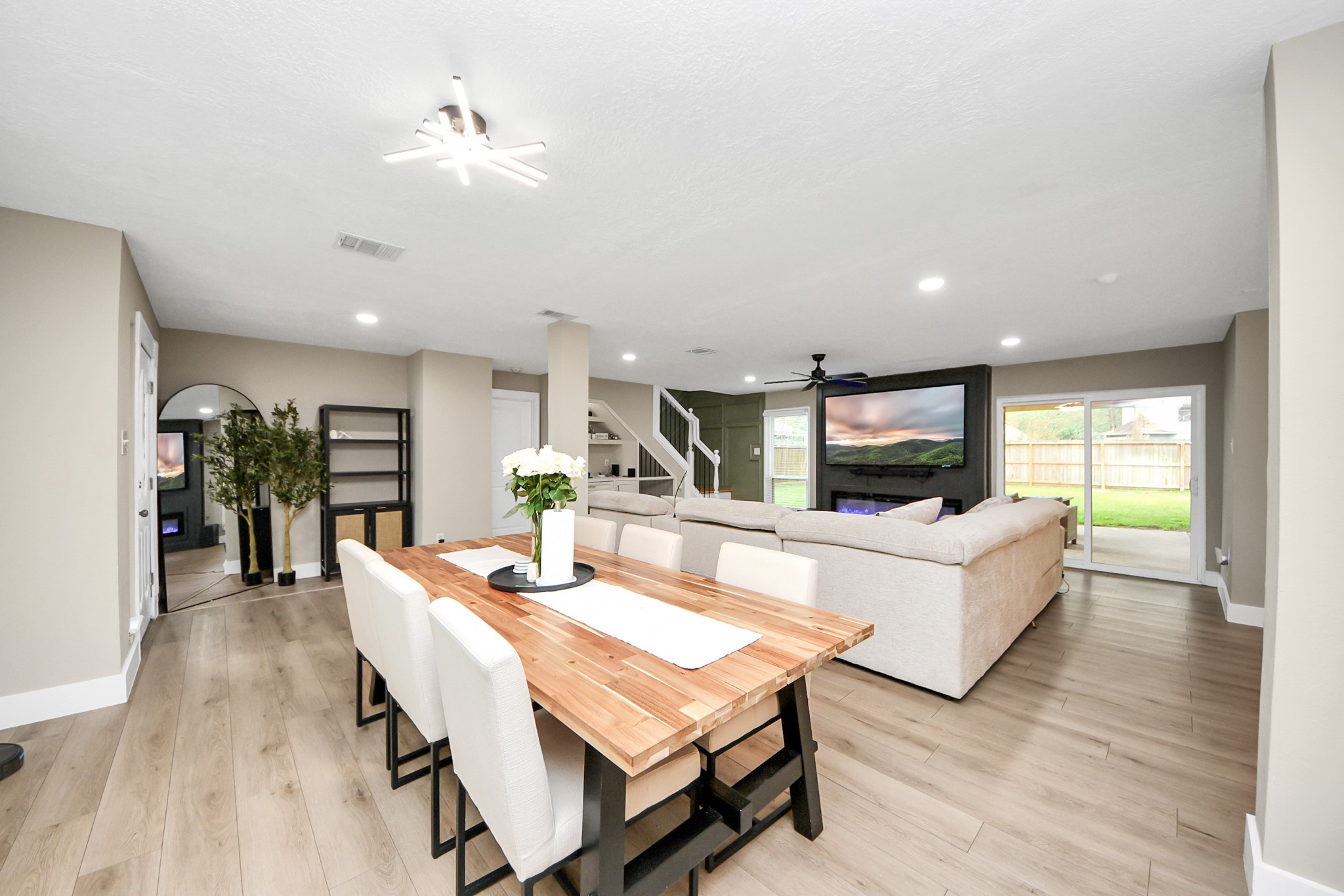 5511 Lacreek Lane Spring, TX 77379 - Photo 11 of 39 a living room with furniture kitchen view and a wooden floor