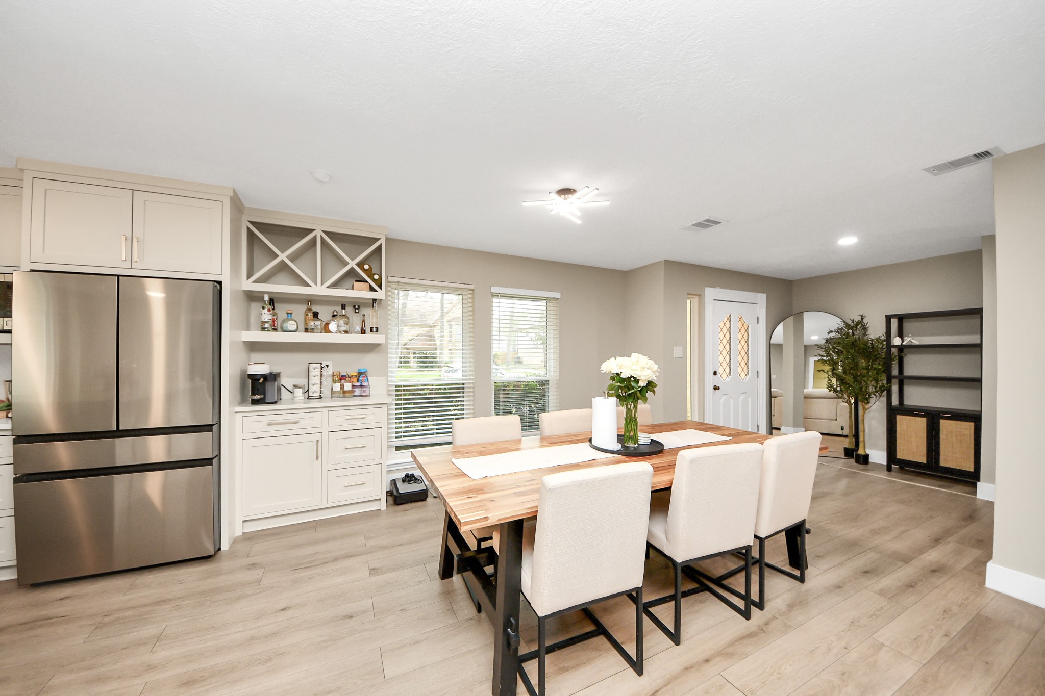 5511 Lacreek Lane Spring, TX 77379 - Photo 12 of 39 a view of a dining room with furniture window and wooden floor