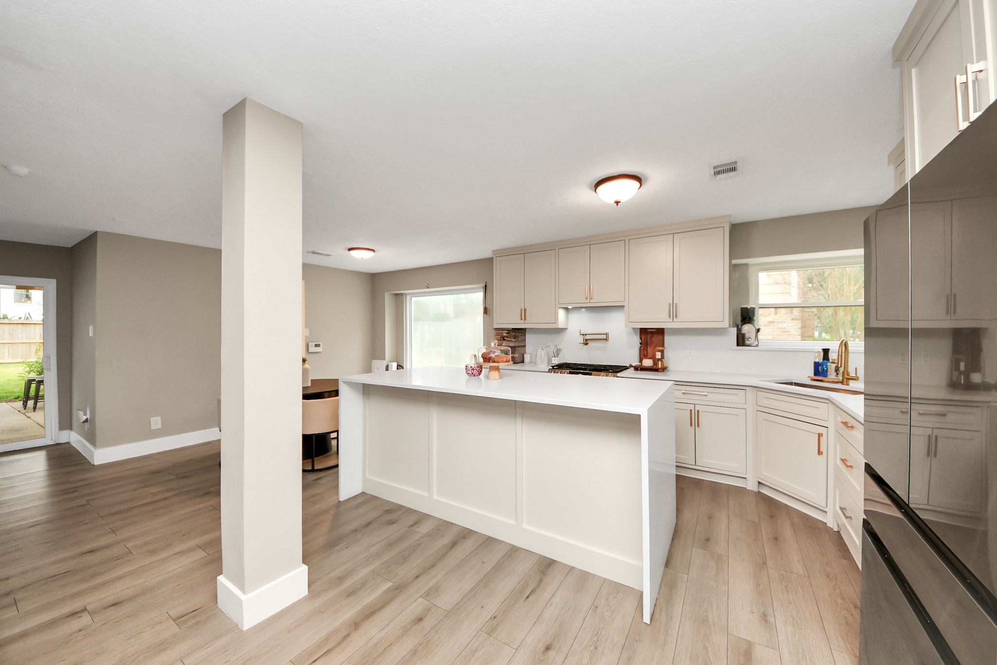 5511 Lacreek Lane Spring, TX 77379 - Photo 13 of 39 a kitchen with white cabinets and appliances