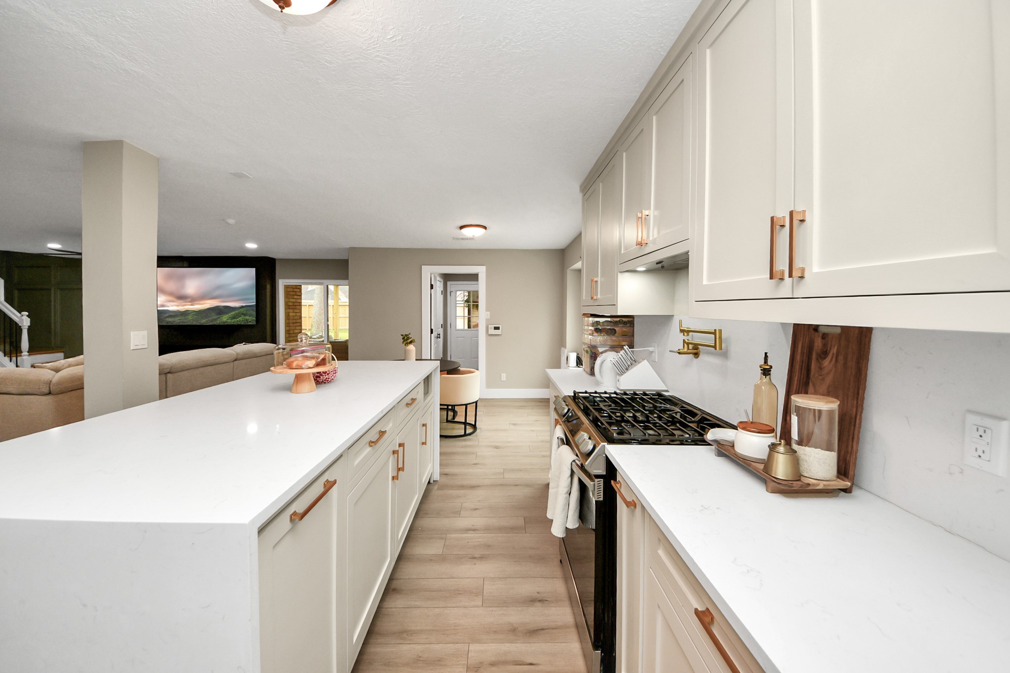 5511 Lacreek Lane Spring, TX 77379 - Photo 15 of 39 a kitchen with a sink a counter top space stainless steel appliances and cabinets