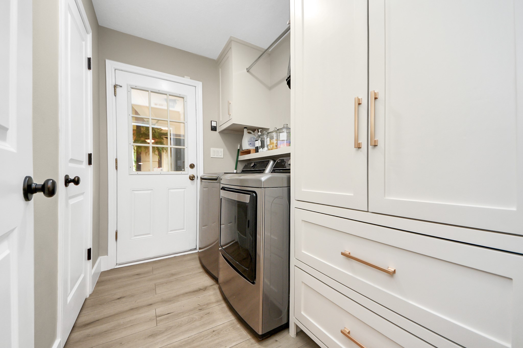 5511 Lacreek Lane Spring, TX 77379 - Photo 18 of 39 a kitchen with a refrigerator and white cabinets