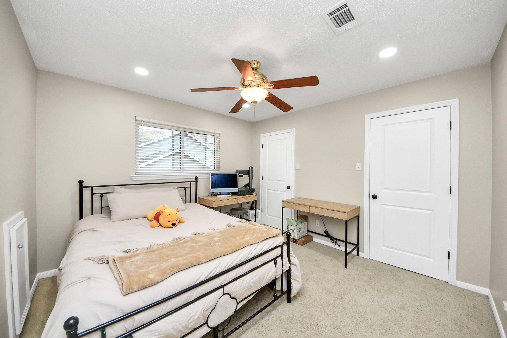5511 Lacreek Lane Spring, TX 77379 - Photo 21 of 39 a bedroom with a bed and a table in it
