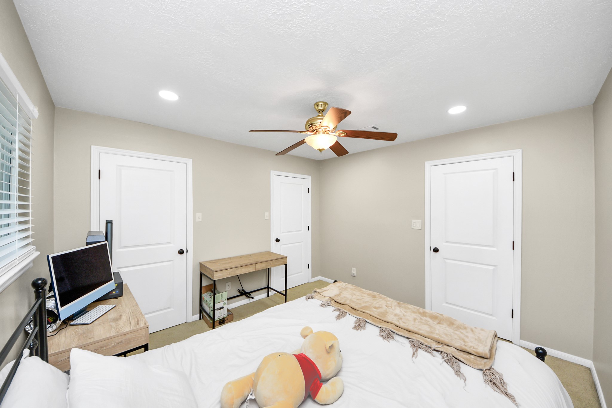 5511 Lacreek Lane Spring, TX 77379 - Photo 23 of 39 a bedroom with a bed and a chandelier