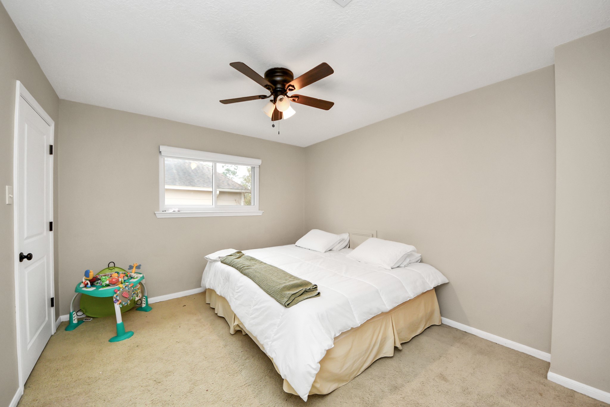 5511 Lacreek Lane Spring, TX 77379 - Photo 29 of 39 a bedroom with a bed and a window