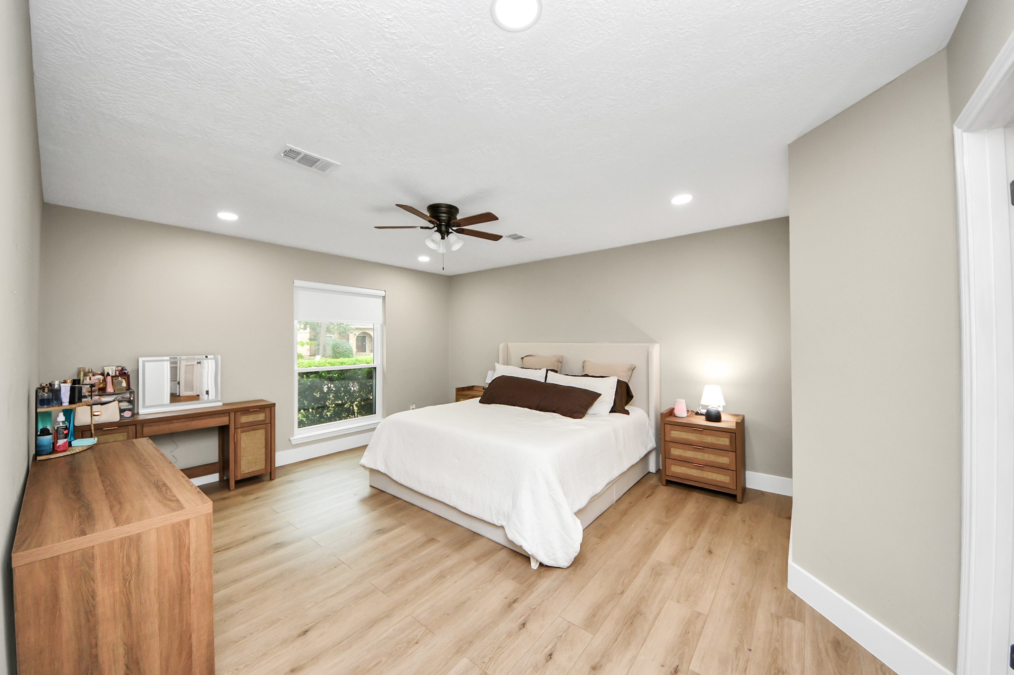 5511 Lacreek Lane Spring, TX 77379 - Photo 31 of 39 a bedroom with a bed and wooden floor