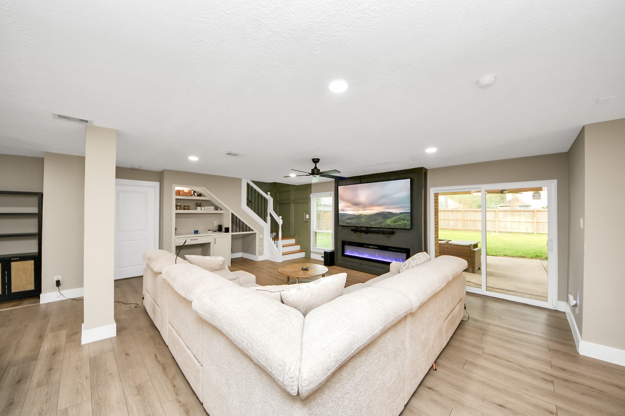 5511 Lacreek Lane Spring, TX 77379 - Photo 7 of 39 a living room with furniture and a flat screen tv